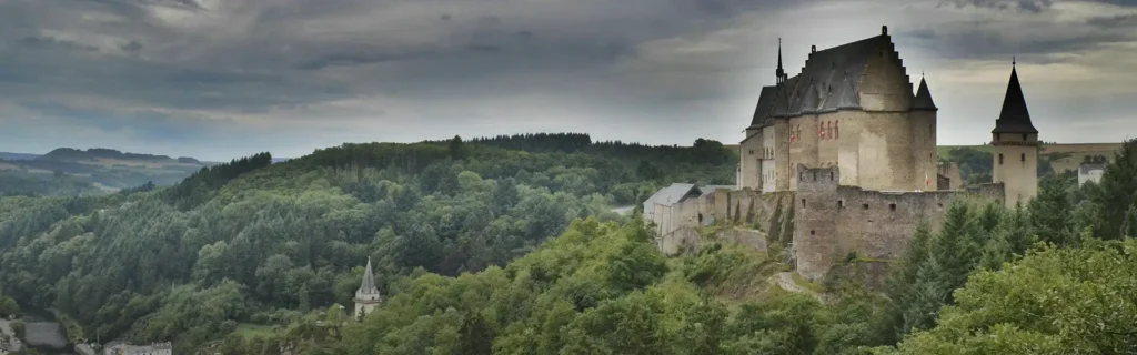 Castle in Luxembourg surrounded by forest - happiest countries in the world