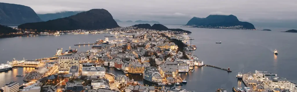 Bird's eye view of Alesond in Norway at dusk - happiest countries in the world