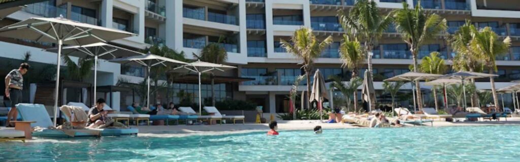 people swimming in a pool at a five star resort in st kitts