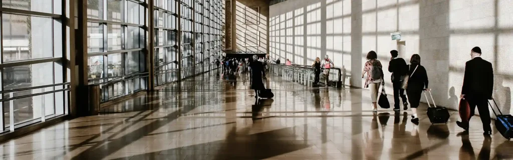 People milling about in an airport - risks of medical tourism