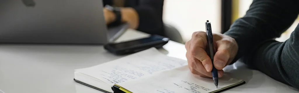 Person taking notes on the documents required for russians applying for turkey citizenship