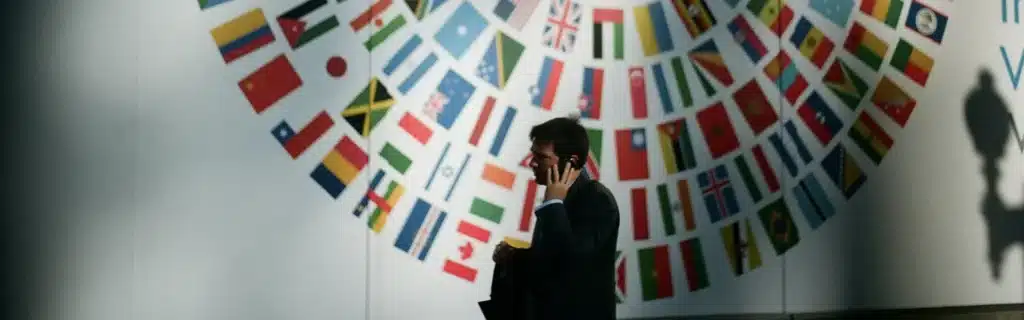 person on the phone with flags on the back