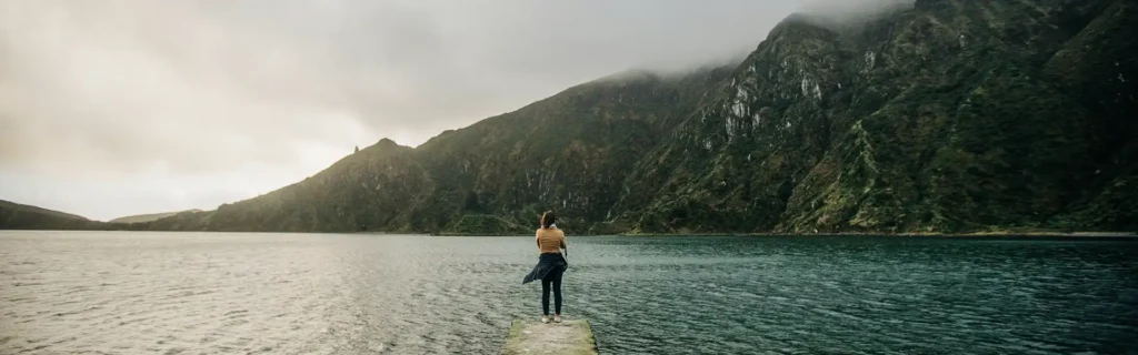 person next to a lake in São Miguel island in the Azores