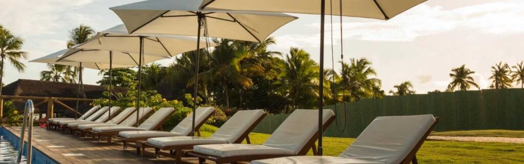 sandals hotel deck chairs at sunset in st lucia