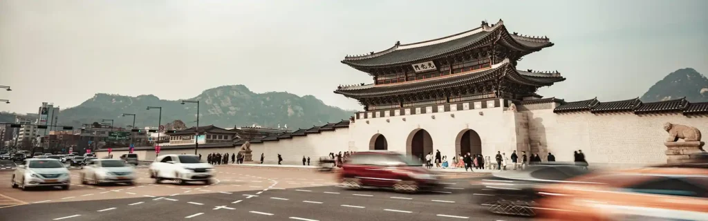 Temple in South Korea with cars racing by in front - medical tourism destination