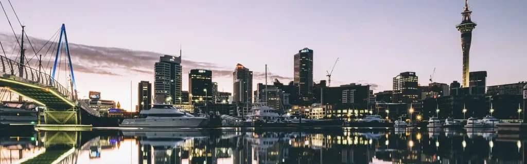 skyline of Auckland in New Zealand by night - New Zealand Active Investor Plus Visa