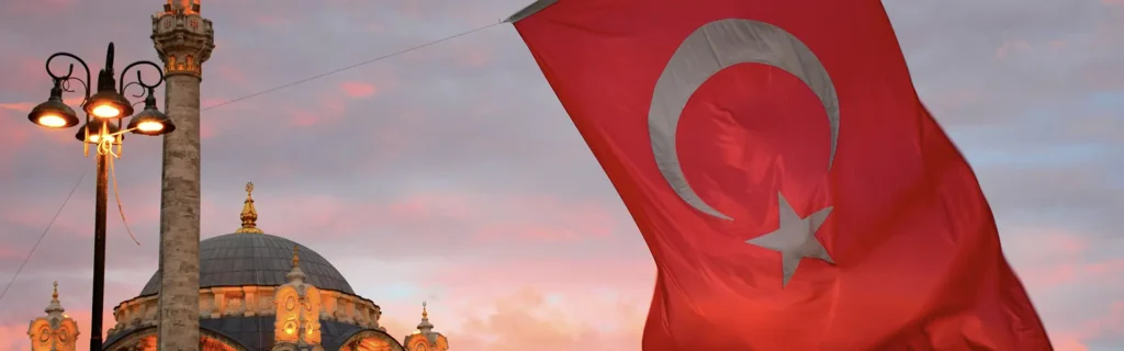 Turkey Flag in front of an official building: Turkey Citizenship by Investment 