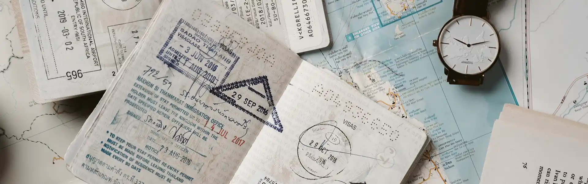 A couple of passports over a map