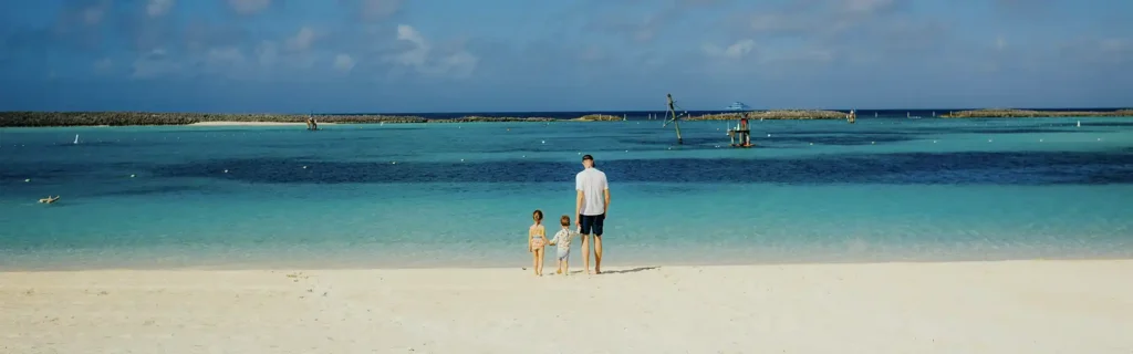 Family on a beach in The Bahamas overlooking the ocean