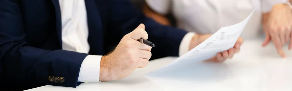 people in a meeting with a Monaco Immigration Agency 