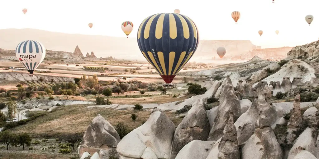 hot air balloons in the air in Cappadocia, turkey